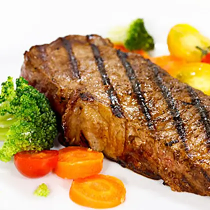 Barbecued Peppered Steaks in Beer and Garlic