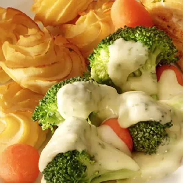 Duchess piped Potatoes with veggies and a cream sauce