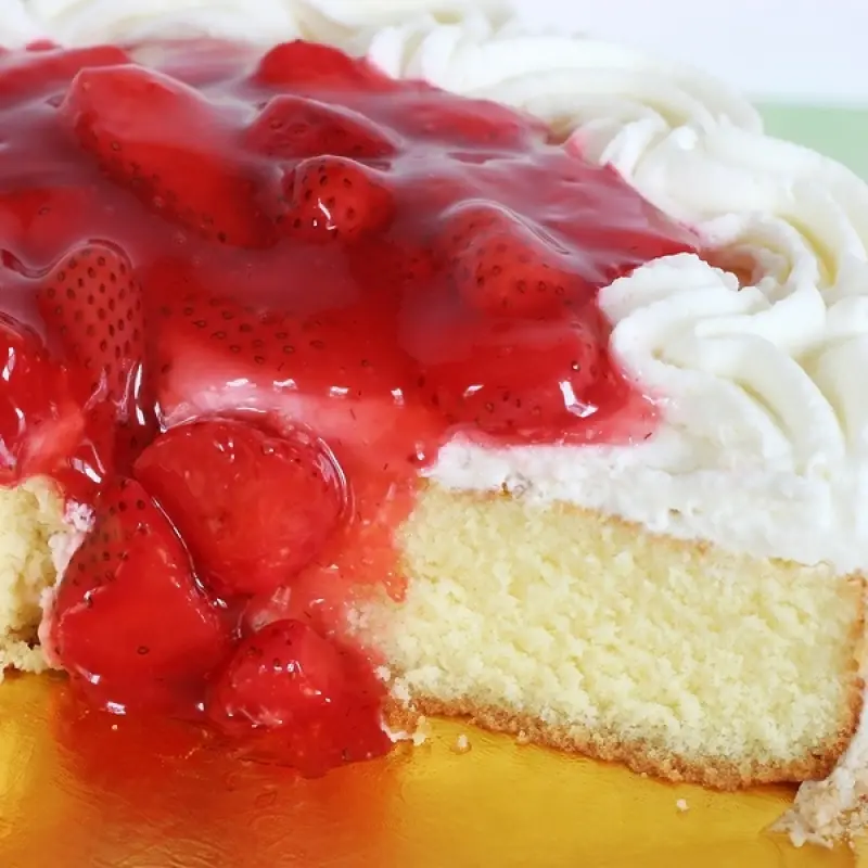 Vanilla Cake With Whipped Cream and Strawberries.