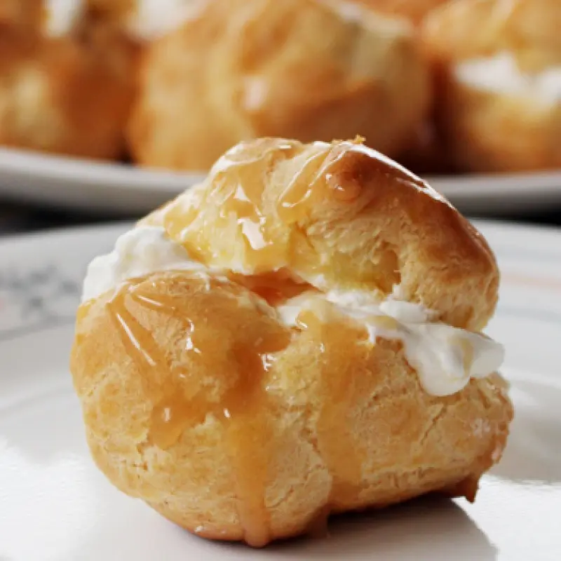Cream Puffs with Whipped Cream and Salted Caramel Drizzle